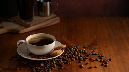 Close up view of coffee table with hot coffee cup and biscuit