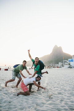 Friends having fun on the beach of Ipanema, Rio de Janeiro, Brazil