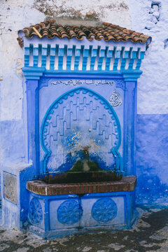 Blue arab fountain in Chefchaouen, Morocco.