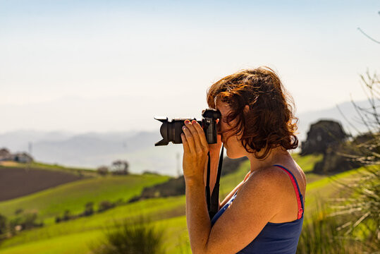 Woman take photo on mountain nature in Spain