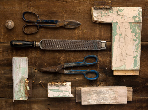 Arrangement of Vintage Tools and Parts of Old Door