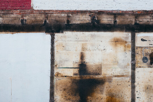Detail of painted, old and weathered wall of demolished building