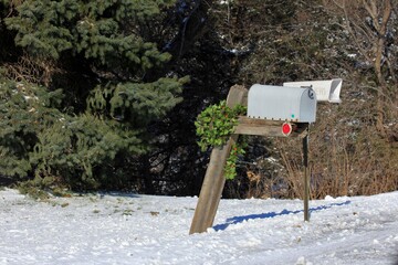 Mail Boxes on a rural route with a Christmas Wreath out in the country in Kansas.