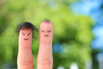 Fingers art of couple. This man is upset because he is bald.