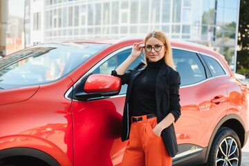 Close Up Portrait of One Stylish Young Female Posing Near the Car