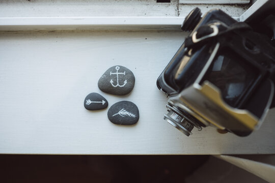Aerial view of a vintage Camera and cool painted rocks