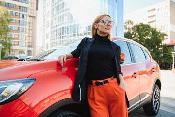 Close Up Portrait of One Stylish Young Female Posing Near the Car