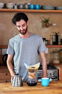 Man preparing morning coffee