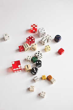 a collection of vintage dice scattered on a white background