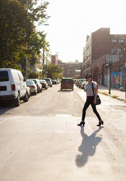 Beautiful brunette crossing the road in New York