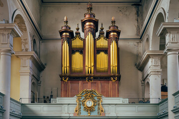 Gold musical organ screen in old church