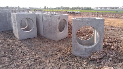 Concrete drainage pipes.Construction of main water supply pipeline. Laying underground storm sewers...