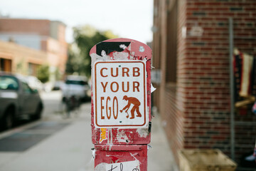 Curb your ego sign