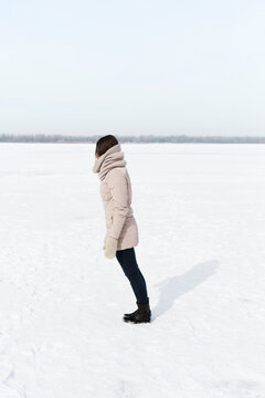 young woman starting fall on the snow background