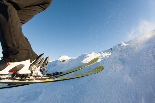Freeskier jumping over a bump