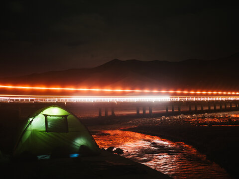 Tent by the bridge enlightened by red light