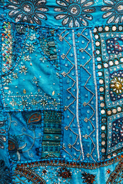 Decorative pattern on a blue traditional Indian piece of fabric. India texture