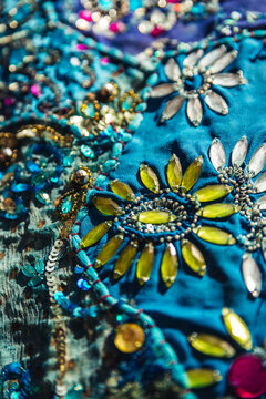 Decorative flower pattern on traditional fabric in a local market. India