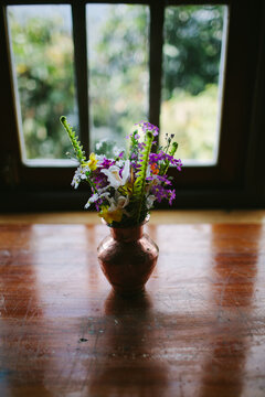 Wild flowers in a galvanised pot on the table