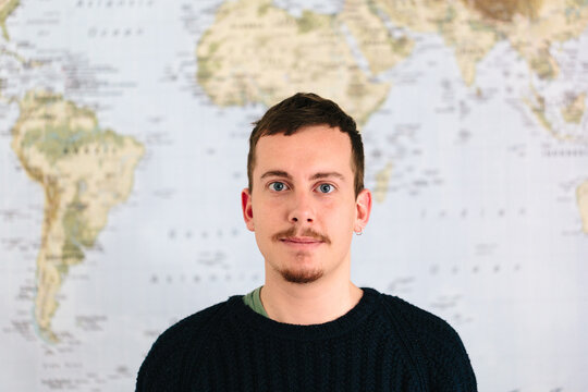 Man portrait with a world map as background