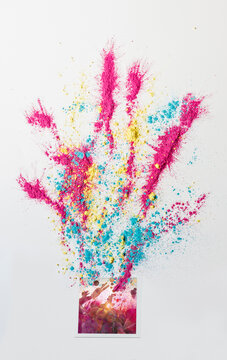 Photo taken at a festival with colorful holi powder all over it
