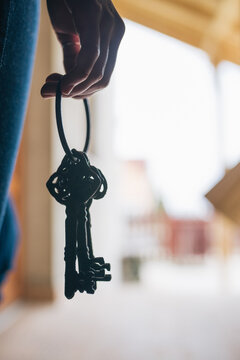 Female hand holding a bunch of old keys