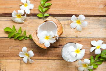 healthy drinks fruits coconut juice cold cocktail water for health care with flower frangipani of lifestyle relax summer arrangement flat lay style on background wooden