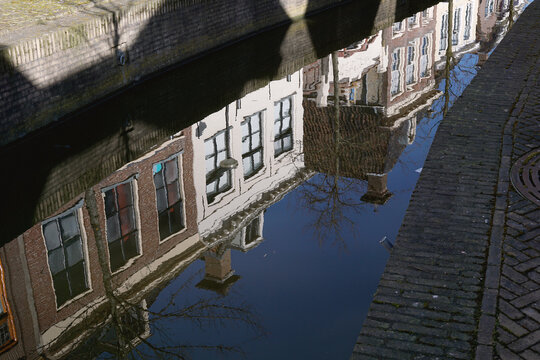 Pretty historical houses in Holland reflected in a canal