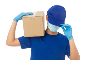 Fototapeta na wymiar Young Delivery man wearing mask and medical gloves holding paper cardboard box mockup isolated on white background with clipping path.