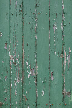 Old wood texture with peeling green paint