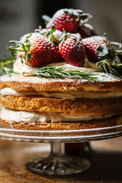 Closeup of a strawberry and cream genoise layer sponge cake.