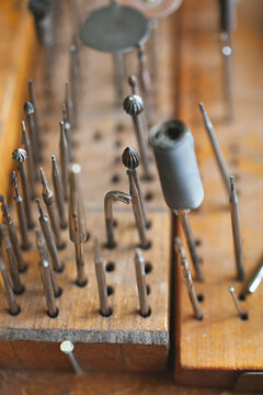 close up of tools on a jewellers work bench / studio