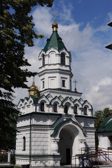 Fototapeta na wymiar St. Alexander Nevsky Orthodox Church in Sokolka city in eastern Poland in summer over blue sky with clouds
