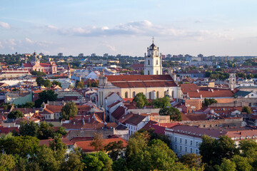 Vilnius. Old city. Streets and roofs of old Vilnius at sunset. A quiet day in a calm city. Cathedral and the palace of the rulers. Roofs of buildings and cathedral at sunset. 