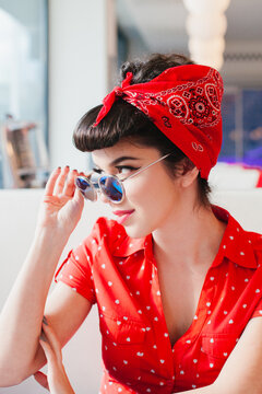 Portrait of handsome rockabilly girl in retro outfit form 1950's.