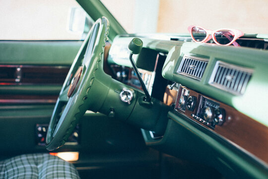 Pristine vintage car with a green plaid interior