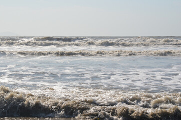 The restless sea or the sea after a storm. Waves and windy weather no people