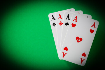 four aces on green background