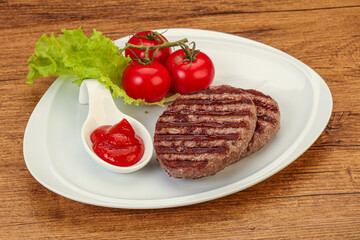 Grilled burger cutlet with sauce