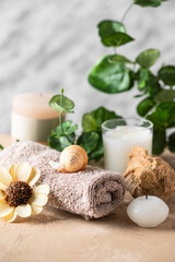 Beautiful spa composition and wellness concept. Different aromatic candles, sea shell and towel...