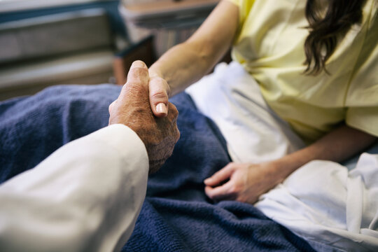 Hospital: Patient Shows Trust By Shaking Hands With Doctor