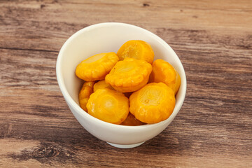 Marinated yellow patisson in the bowl