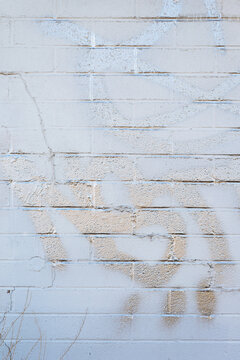 metallic graffiti on a white wall