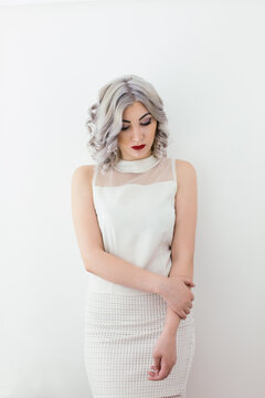 Grey haired fashion young woman portrait in white clothes