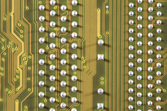 close-up of electronic circuit golden board background of computer motherboard.