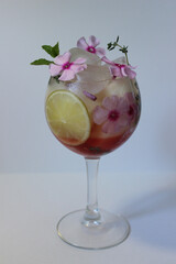 Fruit lemon tea with ice cubes and decorated with mint leaf close up