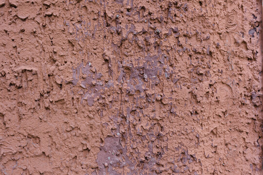 Worn red stucco wall background