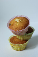 Homemade dessert for tea three cupcakes in a yellow wrapper