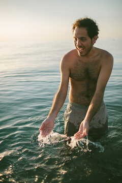 Young man having fun on the beach