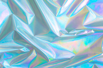 Abstract Modern pastel colored holographic background in 80s style. Crumpled iridescent foil textile real texture. Synthwave. Vaporwave style. Retrowave, retro futurism, webpunk